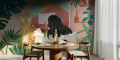 Woman taking bath in pink tropical bathroom