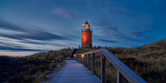 Wall mural Lighthouse in winter – fototapet med unikt motiv som skapar en inspirerande fondvägg
