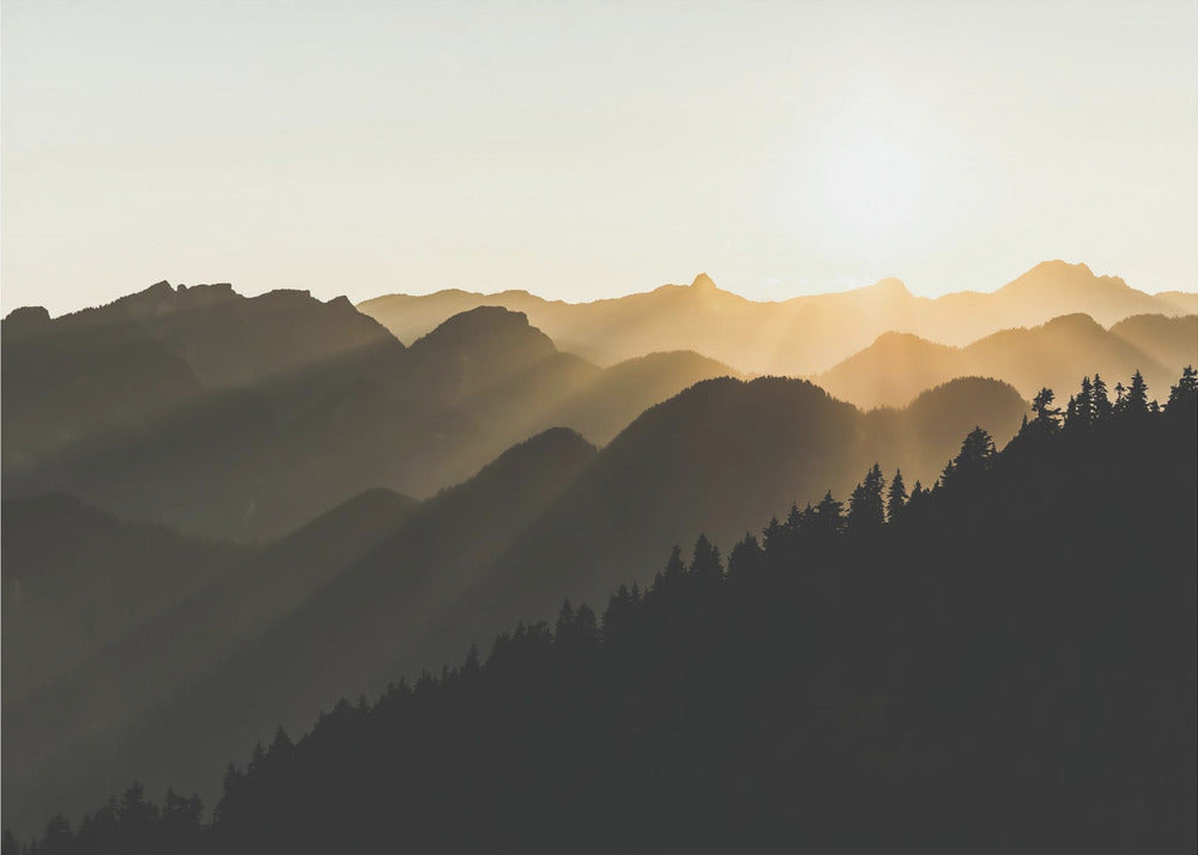 Sunset sun rays over the mountains