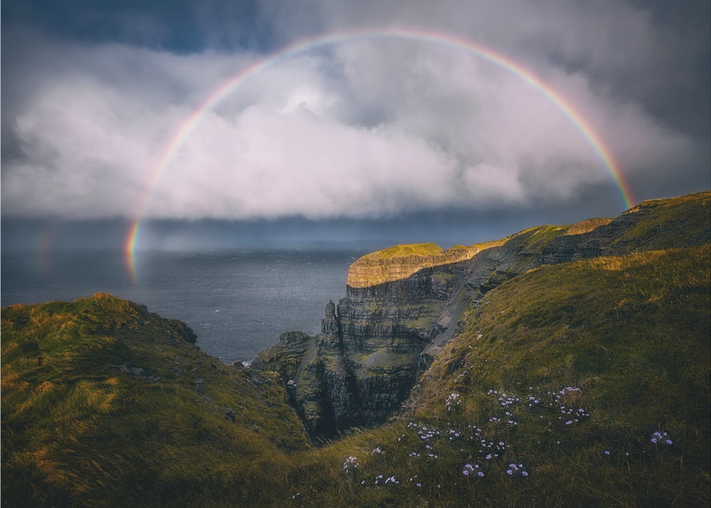 Rainbow Over Wild Cliffs