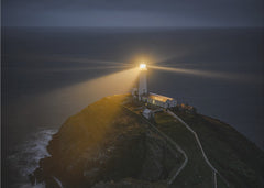 Guiding Lighthouse At Night